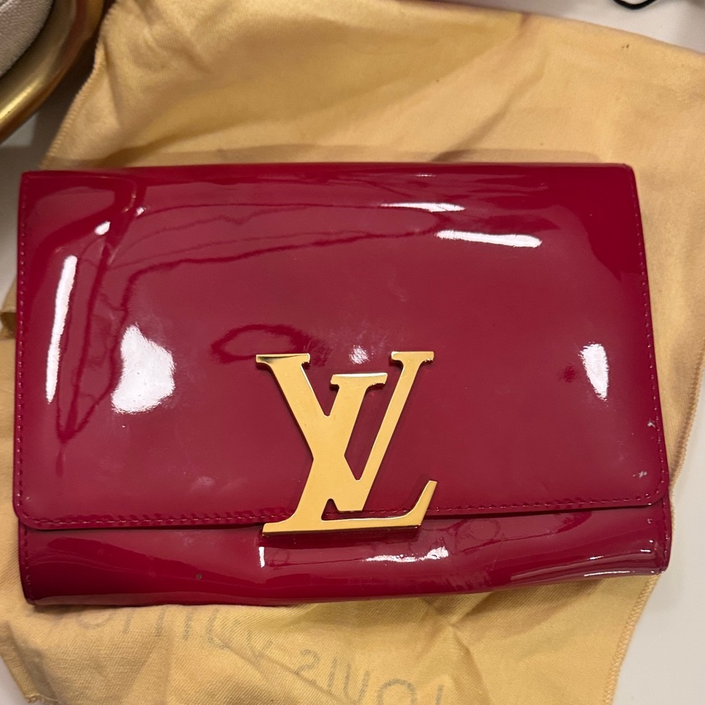 a Louis Vuitton Louise Vernis Patent Leather Clutch.